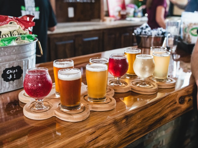 Several different glasses of beer